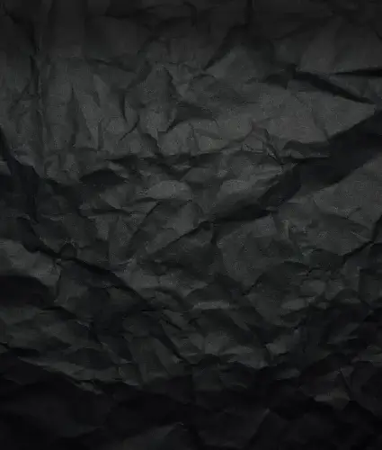 a black crumpled paper background